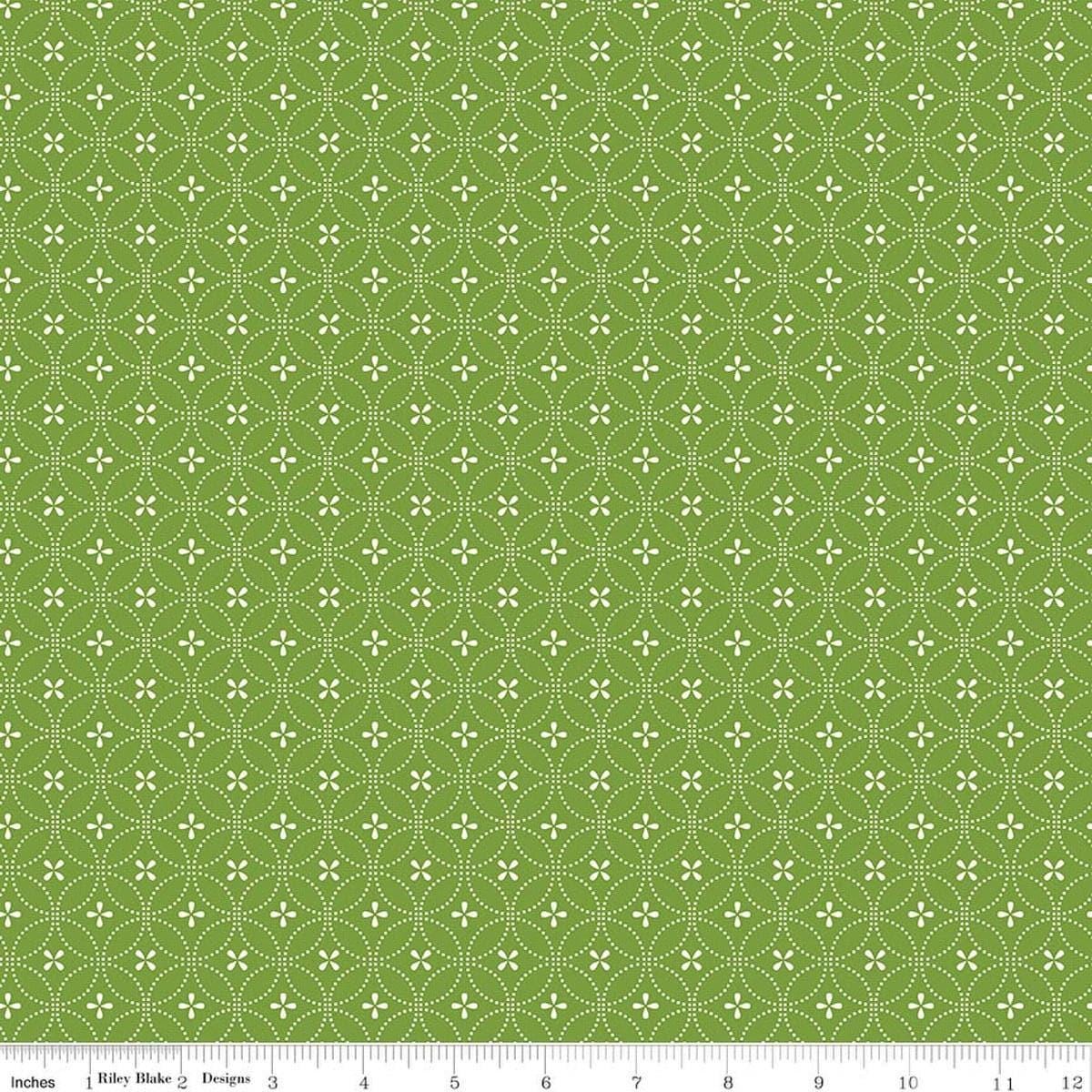 Image of Summer's in Town Circle Dots Green quilting cotton fabric by Sandy Gervais for Riley Blake Designs. Features a geometric design on a green background. Cute Little Fabric Shop.