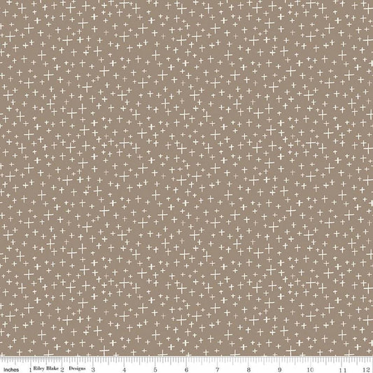 Image of Leo & Savannah Criss Cross Taupe quilting cotton fabric by Deena Rutter for Riley Blake Designs. Features crosses on a brown background. Cute Little Fabric Shop.