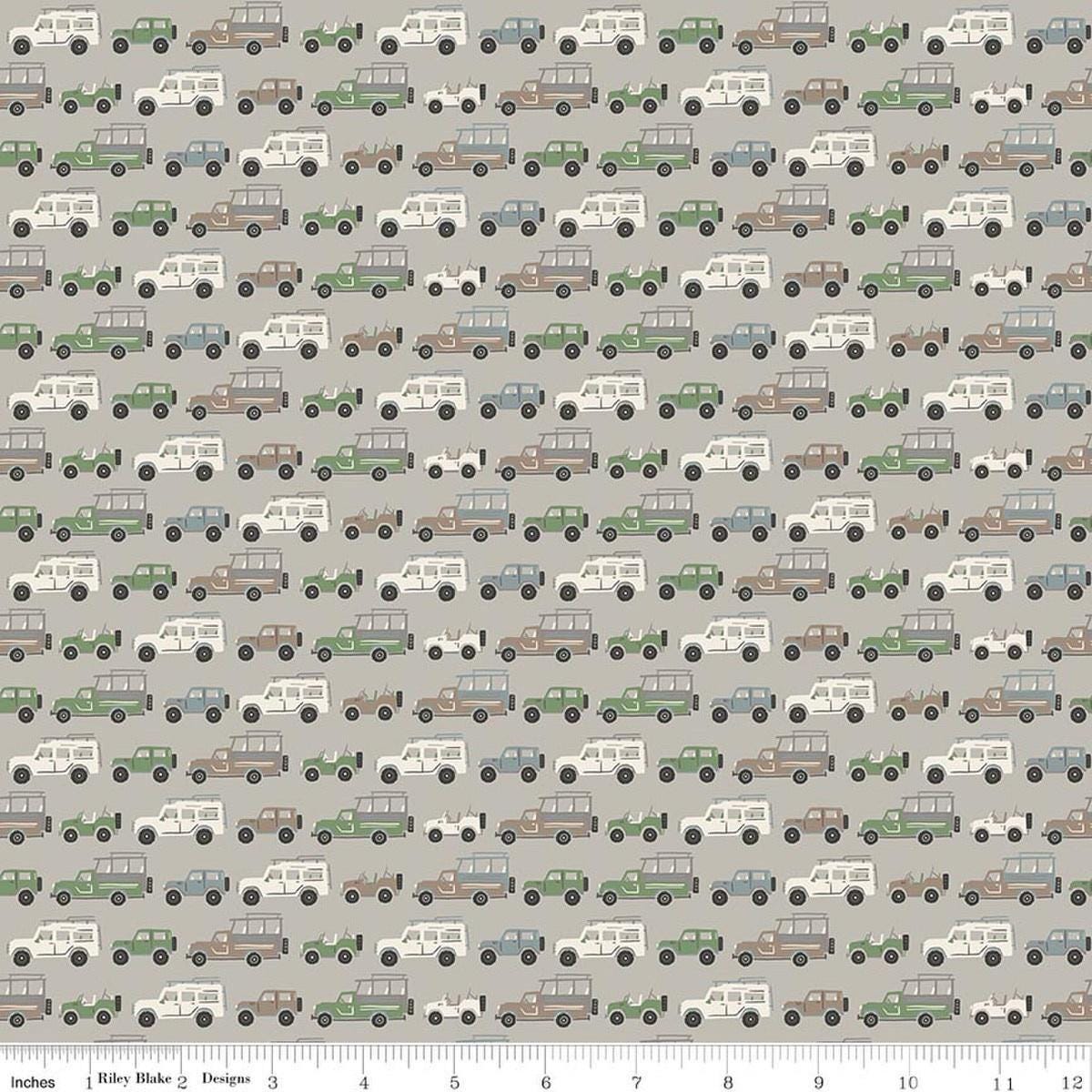 Image of Leo & Savannah Rovers Gray quilting cotton fabric by Deena Rutter for Riley Blake Designs. Features cars on a gray background. Cute Little Fabric Shop.