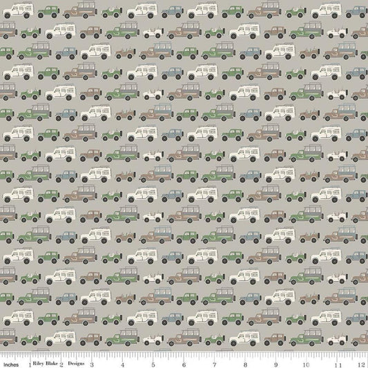 Image of Leo & Savannah Rovers Gray quilting cotton fabric by Deena Rutter for Riley Blake Designs. Features cars on a gray background. Cute Little Fabric Shop.
