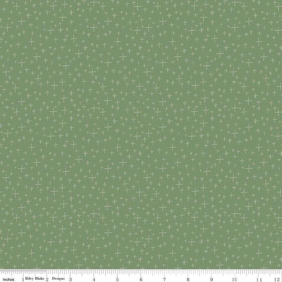 Image of Leo & Savannah Criss Cross Green quilting cotton fabric by Deena Rutter for Riley Blake Designs. Features crosses on a green background. Cute Little Fabric Shop.