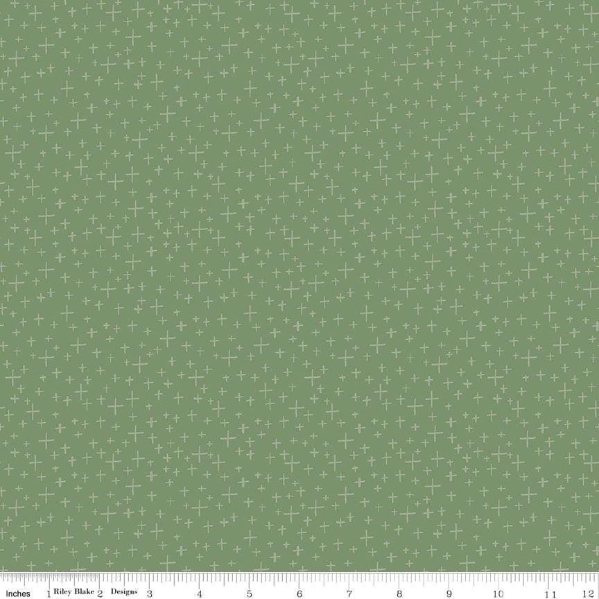 Image of Leo & Savannah Criss Cross Green quilting cotton fabric by Deena Rutter for Riley Blake Designs. Features crosses on a green background. Cute Little Fabric Shop.