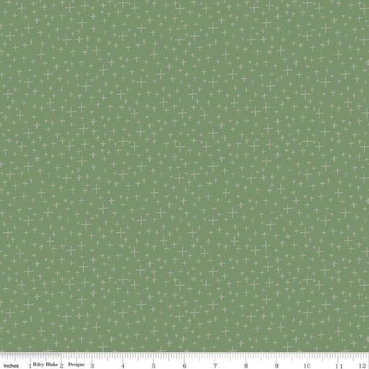 Image of Leo & Savannah Criss Cross Green quilting cotton fabric by Deena Rutter for Riley Blake Designs. Features crosses on a green background. Cute Little Fabric Shop.