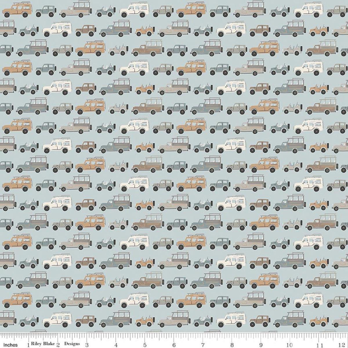 Image of Leo & Savannah Rovers Blue quilting cotton fabric by Deena Rutter for Riley Blake Designs. Features cars on a blue background. Cute Little Fabric Shop.
