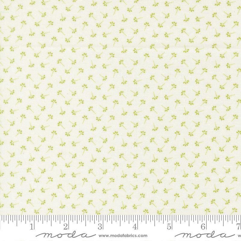 Image of Summers End Dandelion Clover quilting cotton fabric by Fig Tree Co for Moda Fabrics. Features flowers on a cream background. Cute Little Fabric Shop.