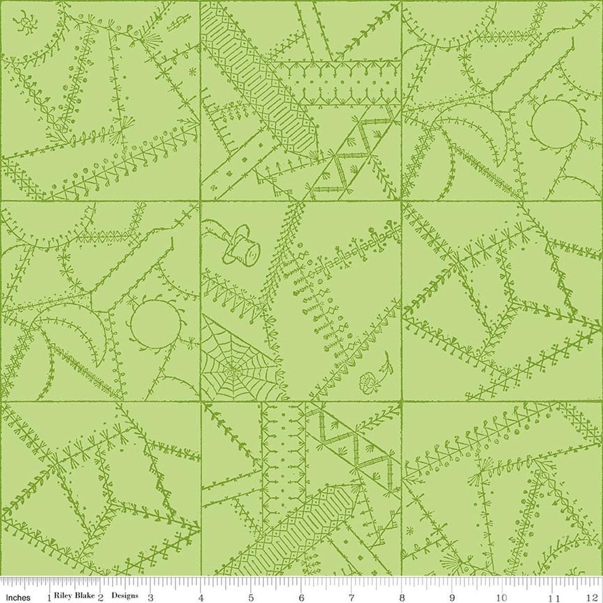 Image of Scary Scraps Crazy Patchwork Green quilting cotton fabric by J Wecker Frisch for Riley Blake Designs. Features a geometric pattern on a green background. Cute Little Fabric Shop.