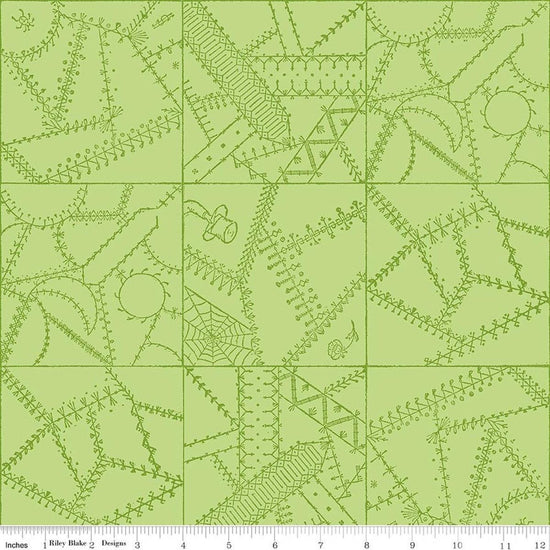 Image of Scary Scraps Crazy Patchwork Green quilting cotton fabric by J Wecker Frisch for Riley Blake Designs. Features a geometric pattern on a green background. Cute Little Fabric Shop.
