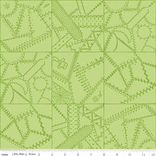 Image of Scary Scraps Crazy Patchwork Green quilting cotton fabric by J Wecker Frisch for Riley Blake Designs. Features a geometric pattern on a green background. Cute Little Fabric Shop.
