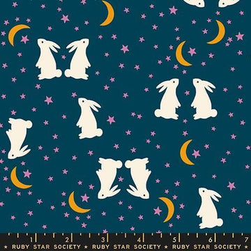 Image of Mystic Fable Fable Bunnies Galaxy quilting cotton fabric by Alexia Abegg of Ruby Star Society for Moda Fabrics. Features bunnies and stars on a blue background. Cute Little Fabric Shop.