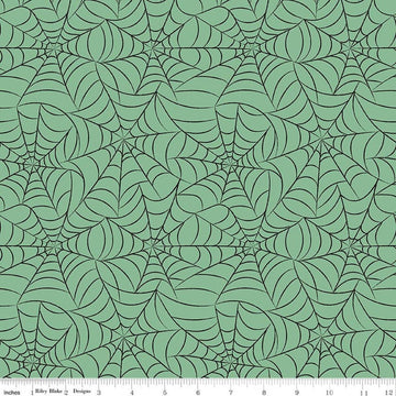 Image of Frank and Friends Webs Green quilting cotton fabric by My Mind's Eye for Riley Blake Designs. Features spider webbing on a green background. Cute Little Fabric Shop.