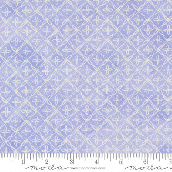 Image of Delphinium Flourish Lilac quilting cotton by Janet Clare for Moda Fabrics. Features a geometric pattern on a blue background. Cute Little Fabric Shop.