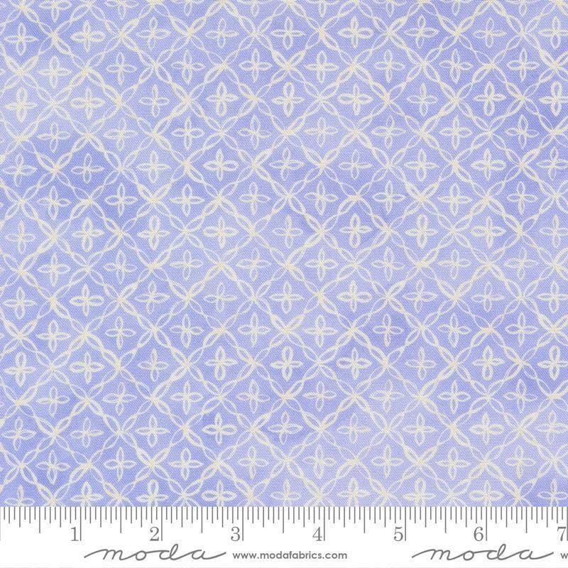 Image of Delphinium Flourish Lilac quilting cotton by Janet Clare for Moda Fabrics. Features a geometric pattern on a blue background. Cute Little Fabric Shop.