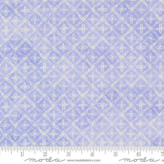 Image of Delphinium Flourish Lilac quilting cotton by Janet Clare for Moda Fabrics. Features a geometric pattern on a blue background. Cute Little Fabric Shop.