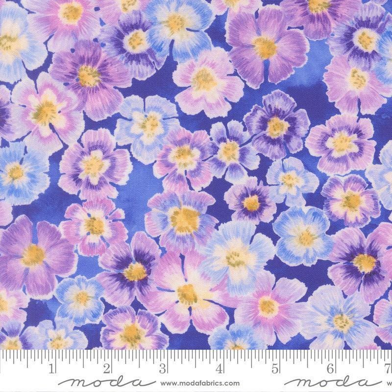Image of Delphinium Auricula Agapanthus quilting cotton by Janet Clare for Moda Fabrics. Features flowers on a blue background. Cute Little Fabric Shop.