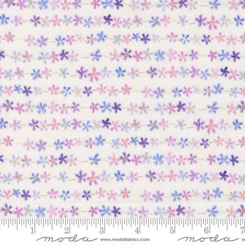 Image of Delphinium Daisy Chain Snowdrop quilting cotton by Janet Clare for Moda Fabrics. Features flowers on a white background. Cute Little Fabric Shop.