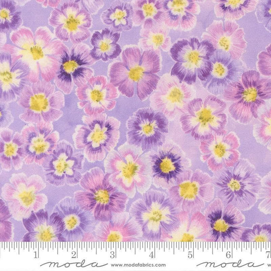 Image of Delphinium Auricula Mauve quilting cotton by Janet Clare for Moda Fabrics. Features flowers on a purple background. Cute Little Fabric Shop.