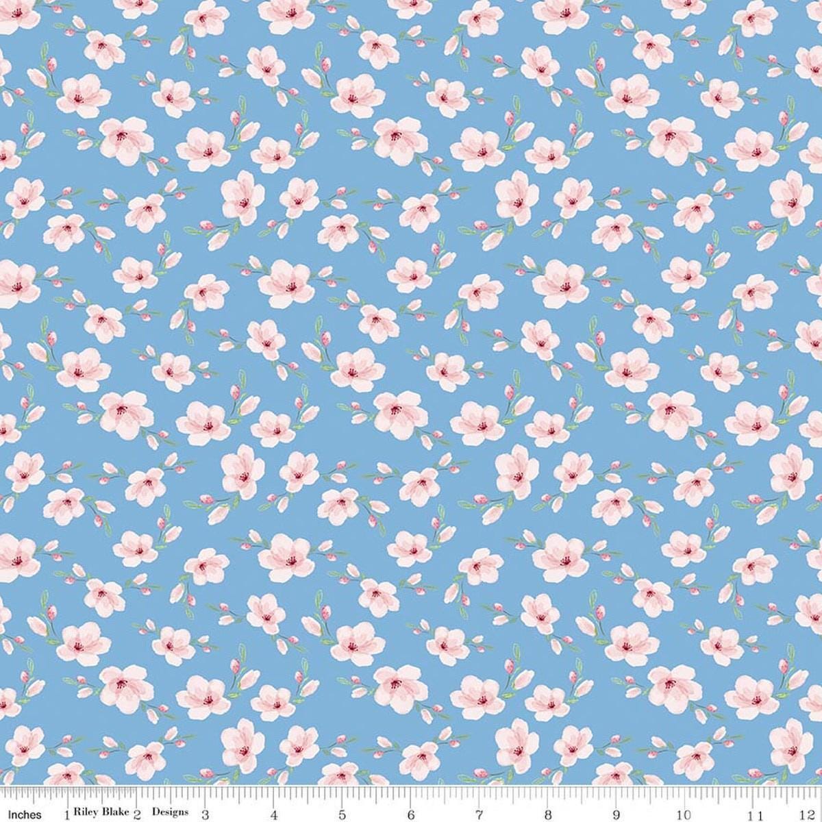 Image of Painted Petals Blossoms Blue quilting cotton fabric by Lila Tueller for Riley Blake Designs. Features flowers on a blue background. Cute Little Fabric Shop.