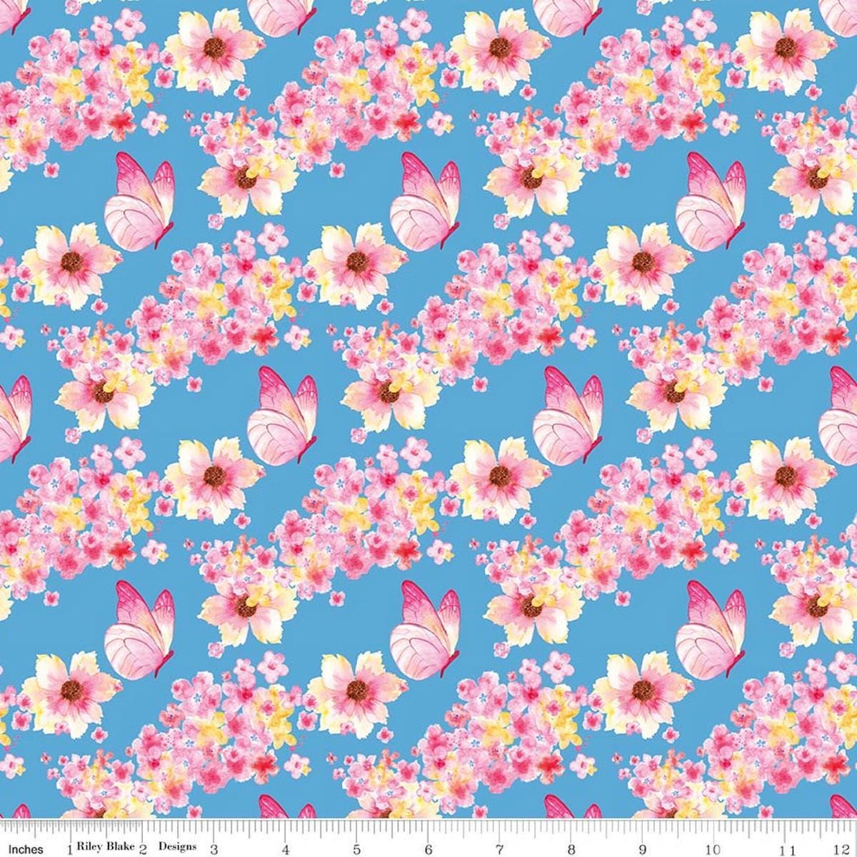 Image of Painted Petals Butterfly Floral Blue quilting cotton fabric by Lila Tueller for Riley Blake Designs. Features flowers on a blue background. Cute Little Fabric Shop.