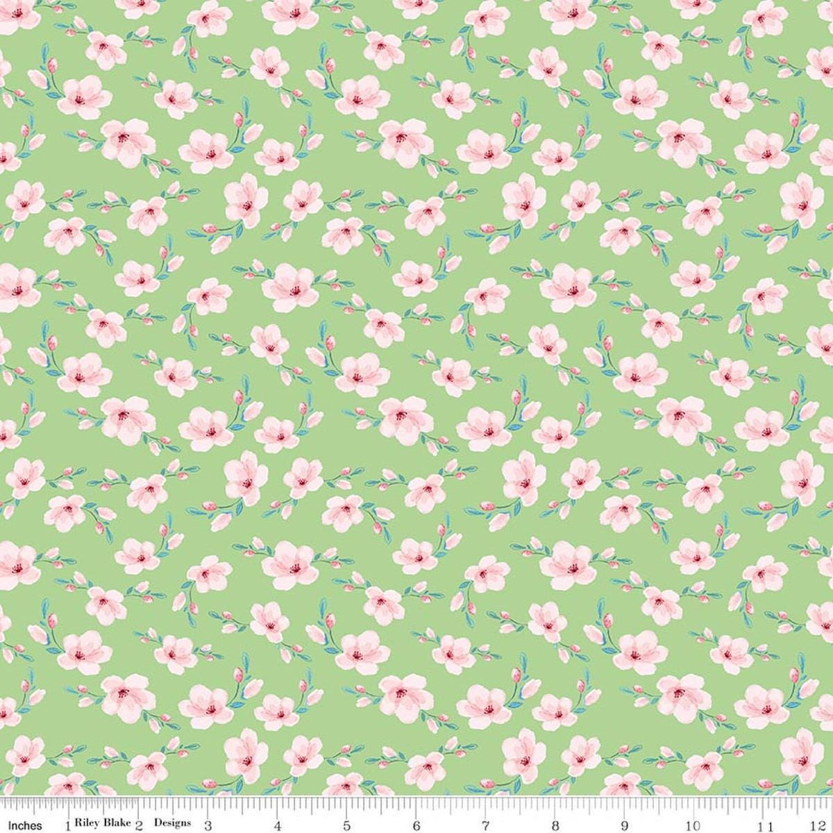 Image of Painted Petals Blossoms Green quilting cotton fabric by Lila Tueller for Riley Blake Designs. Features flowers on a green background. Cute Little Fabric Shop.