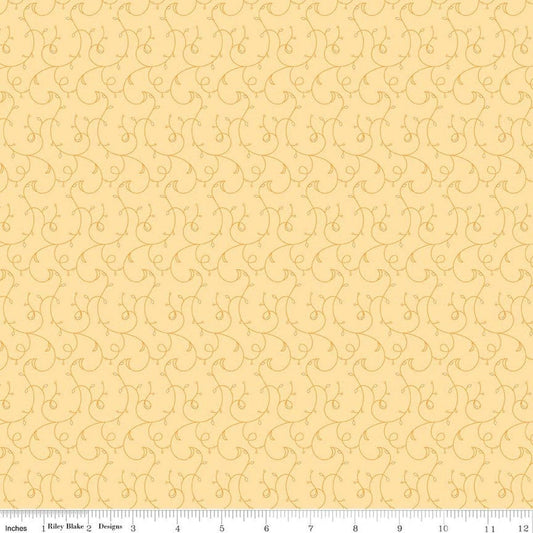 Image of Flourish Vines Lemon quilting cotton fabric by Sue Daley for Riley Blake Designs. Features leaves and vines on a yellow background. Cute Little Fabric Shop.