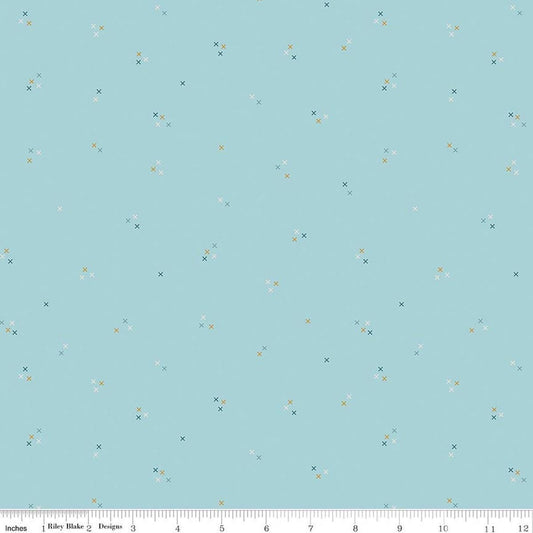 Image of Correspondence Stitching Aqua quilting cotton fabric by Beverly McCullough for Riley Blake Designs. Features tiny xs on a blue background. Cute Little Fabric Shop.