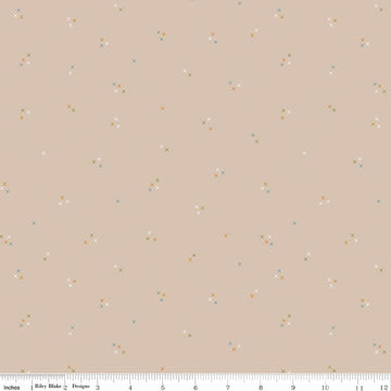 Image of Correspondence Stitching Wheat quilting cotton fabric by Beverly McCullough for Riley Blake Designs. Features tiny xs on a brown background. Cute Little Fabric Shop.