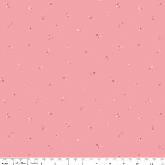 Image of Correspondence Stitching Peony quilting cotton fabric by Beverly McCullough for Riley Blake Designs. Features tiny xs on a pink background. Cute Little Fabric Shop.