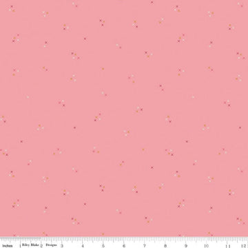 Image of Correspondence Stitching Peony quilting cotton fabric by Beverly McCullough for Riley Blake Designs. Features tiny xs on a pink background. Cute Little Fabric Shop.