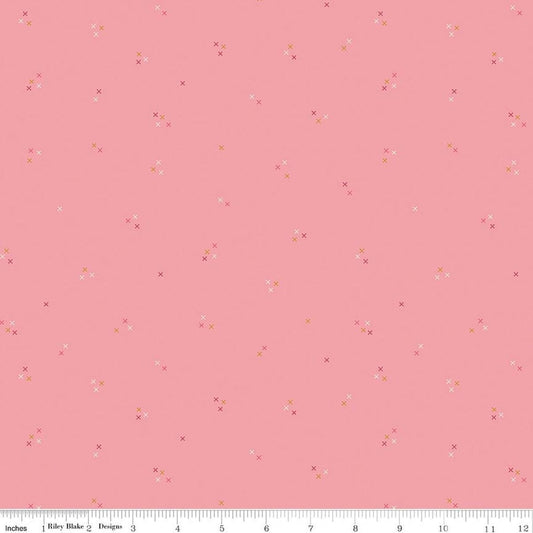 Image of Correspondence Stitching Peony quilting cotton fabric by Beverly McCullough for Riley Blake Designs. Features tiny xs on a pink background. Cute Little Fabric Shop.