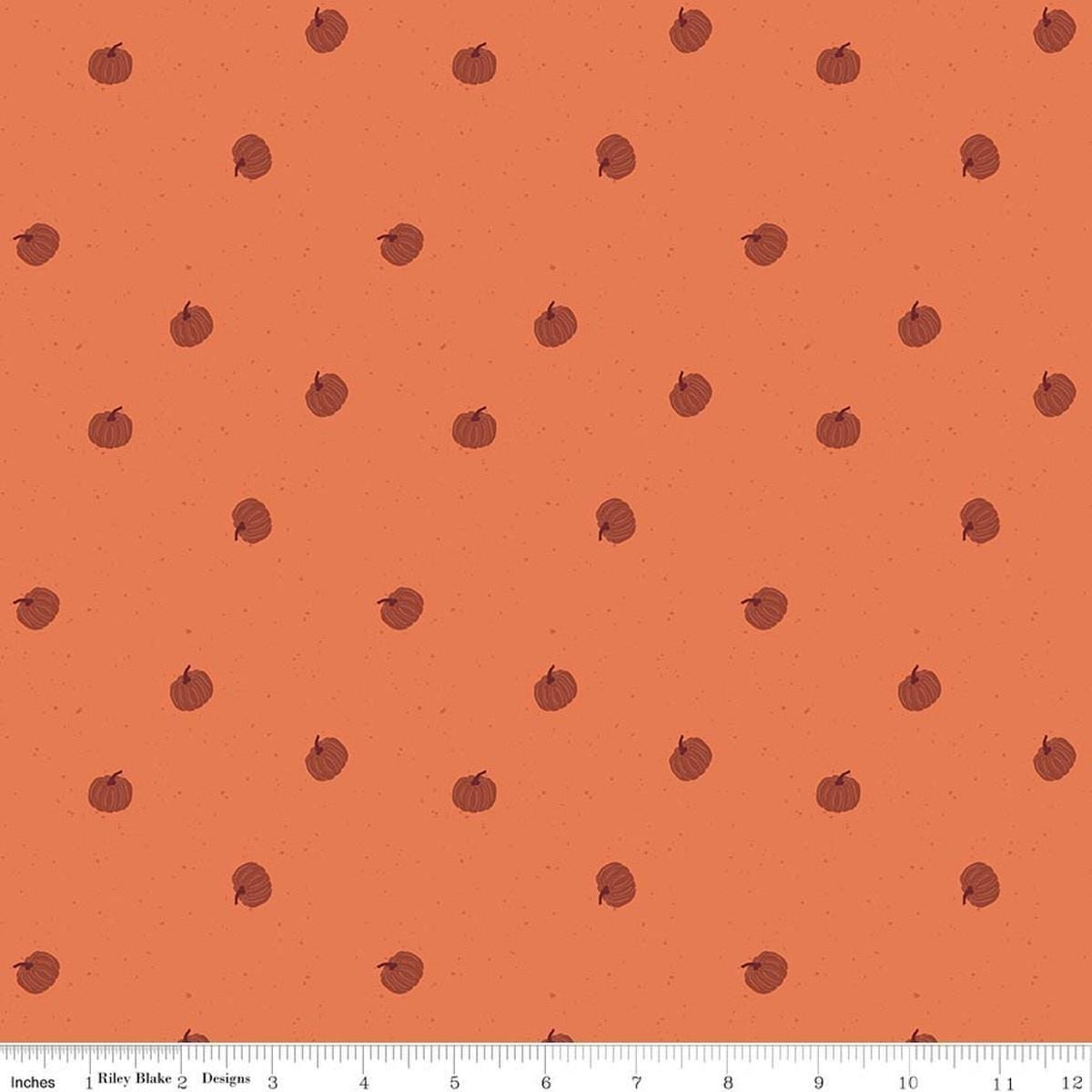 Image of The Apothecary Pumpkin Toss Marmalade quilting cotton fabric by Amber Elliot for Riley Blake Designs. Features pumpkins on an orange background. Cute Little Fabric Shop.