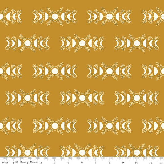 Image of The Apothecary Celestial Gold quilting cotton fabric by Amber Elliot for Riley Blake Designs. Features moons on a gold background. Cute Little Fabric Shop.
