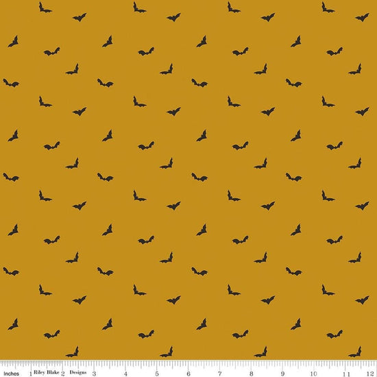 Image of The Apothecary Batwings Gold quilting cotton fabric by Amber Elliot for Riley Blake Designs. Features bats on a yellow background. Cute Little Fabric Shop.
