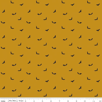 Image of The Apothecary Batwings Gold quilting cotton fabric by Amber Elliot for Riley Blake Designs. Features bats on a yellow background. Cute Little Fabric Shop.