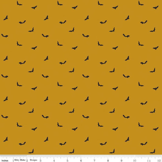 Image of The Apothecary Batwings Gold quilting cotton fabric by Amber Elliot for Riley Blake Designs. Features bats on a yellow background. Cute Little Fabric Shop.