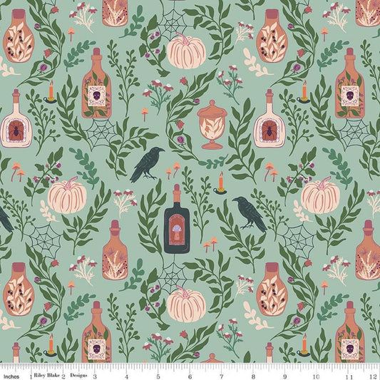 Image of The Apothecary Main Mint quilting cotton fabric by Amber Elliot for Riley Blake Designs. Features bottles on a green background. Cute Little Fabric Shop.