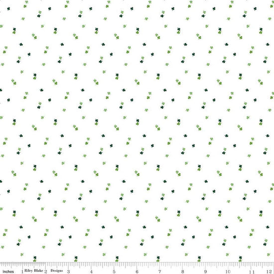 Image of Seasonal Basics Clovers White quilting cotton fabric by Christopher Thompson for Riley Blake Designs. Features clovers on a white background. Cute Little Fabric Shop.