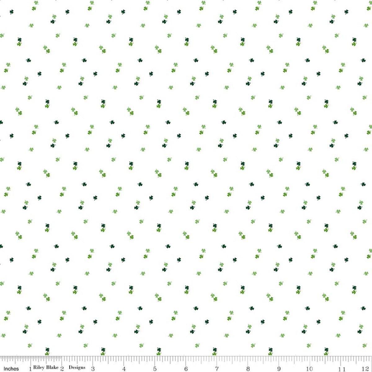 Image of Seasonal Basics Clovers White quilting cotton fabric by Christopher Thompson for Riley Blake Designs. Features clovers on a white background. Cute Little Fabric Shop.