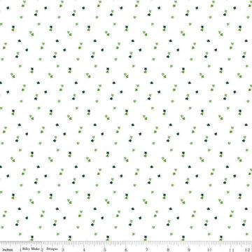 Image of Seasonal Basics Clovers White quilting cotton fabric by Christopher Thompson for Riley Blake Designs. Features clovers on a white background. Cute Little Fabric Shop.