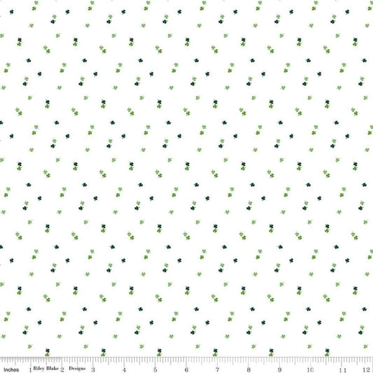 Image of Seasonal Basics Clovers White quilting cotton fabric by Christopher Thompson for Riley Blake Designs. Features clovers on a white background. Cute Little Fabric Shop.