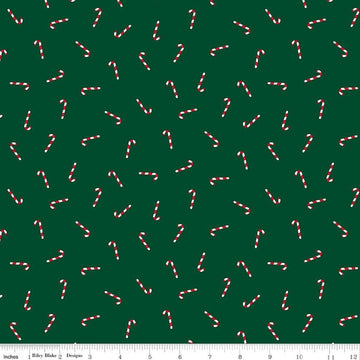 Image of Seasonal Basics Candy Canes Green quilting cotton fabric by Christopher Thompson for Riley Blake Designs. Features candy canes on a green background. Cute Little Fabric Shop.