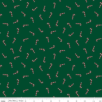 Image of Seasonal Basics Candy Canes Green quilting cotton fabric by Christopher Thompson for Riley Blake Designs. Features candy canes on a green background. Cute Little Fabric Shop.