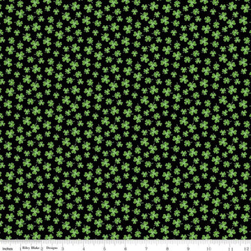Image of Seasonal Basics Shamrocks Black quilting cotton fabric by Christopher Thompson for Riley Blake Designs. Features clovers on a black background. Cute Little Fabric Shop.