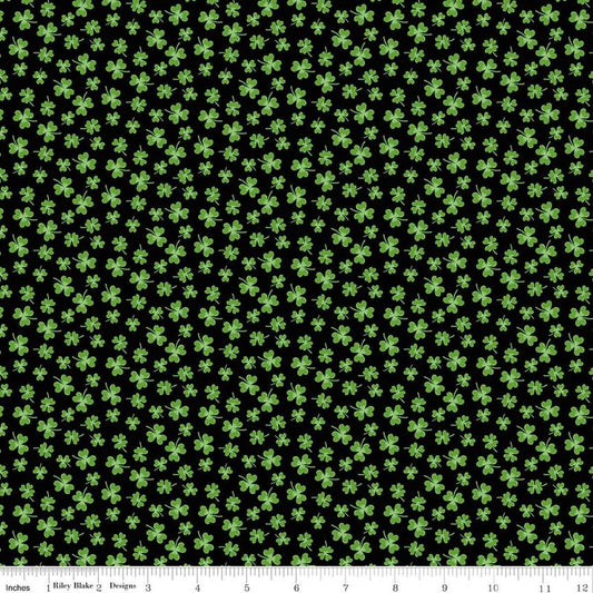 Image of Seasonal Basics Shamrocks Black quilting cotton fabric by Christopher Thompson for Riley Blake Designs. Features clovers on a black background. Cute Little Fabric Shop.