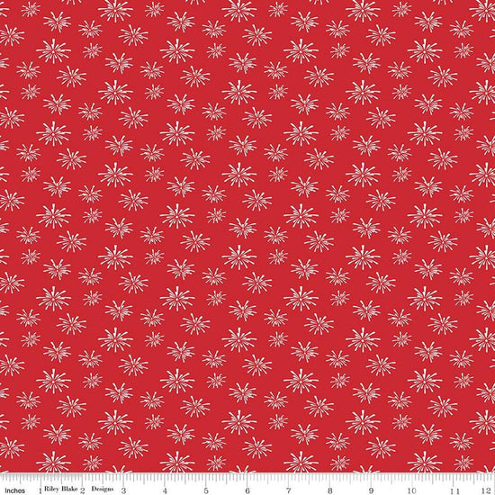 Image of Seasonal Basics Fireworks Red quilting cotton fabric by Christopher Thompson for Riley Blake Designs. Features fireworks on a red background. Cute Little Fabric Shop.
