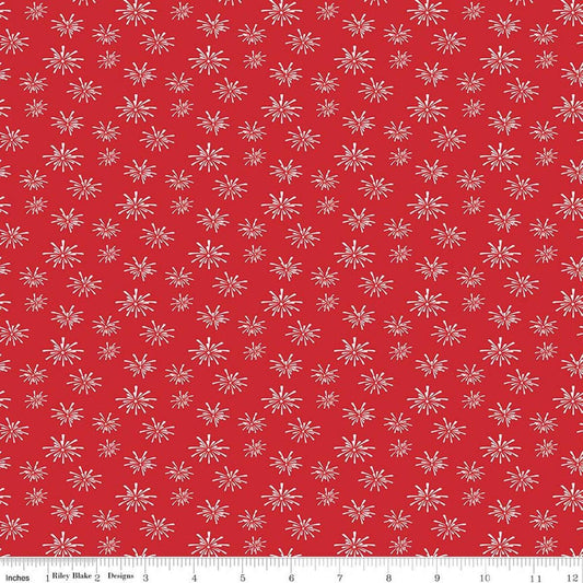 Image of Seasonal Basics Fireworks Red quilting cotton fabric by Christopher Thompson for Riley Blake Designs. Features fireworks on a red background. Cute Little Fabric Shop.
