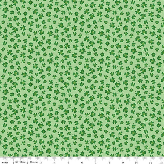 Image of Seasonal Basics Shamrocks Green quilting cotton fabric by Christopher Thompson for Riley Blake Designs. Features clovers on a green background. Cute Little Fabric Shop.