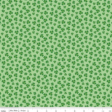 Image of Seasonal Basics Shamrocks Green quilting cotton fabric by Christopher Thompson for Riley Blake Designs. Features clovers on a green background. Cute Little Fabric Shop.