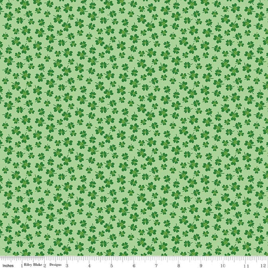 Image of Seasonal Basics Shamrocks Green quilting cotton fabric by Christopher Thompson for Riley Blake Designs. Features clovers on a green background. Cute Little Fabric Shop.