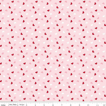 Image of Seasonal Basics Heart Toss Pink quilting cotton fabric by Christopher Thompson for Riley Blake Designs. Features hearts on a pink background. Cute Little Fabric Shop.