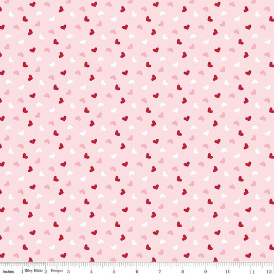 Image of Seasonal Basics Heart Toss Pink quilting cotton fabric by Christopher Thompson for Riley Blake Designs. Features hearts on a pink background. Cute Little Fabric Shop.